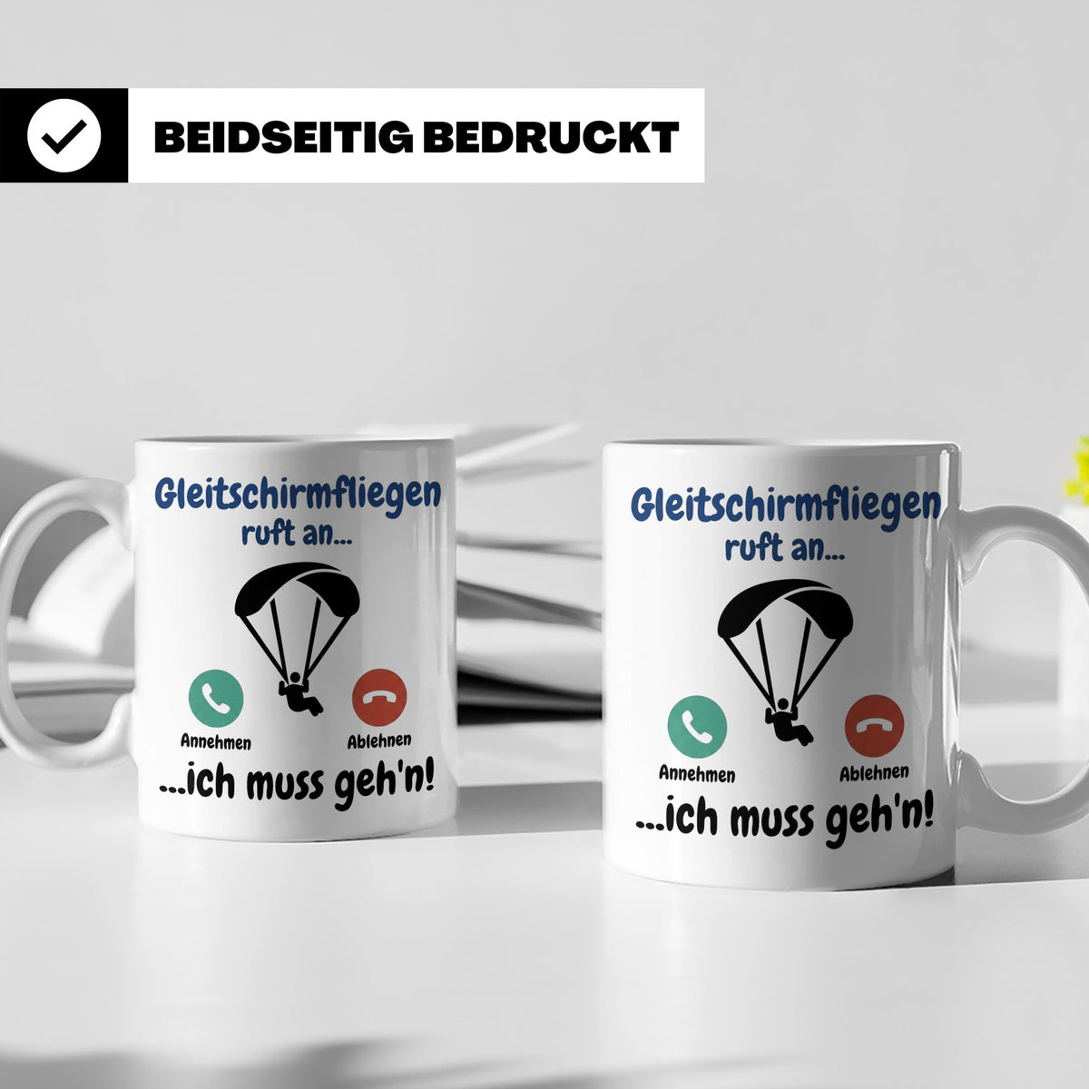 Gleitschirmfliegen Tasse mit Spruch 'ruft an ich muss geh'n' – Weiß [farbe:weiß]