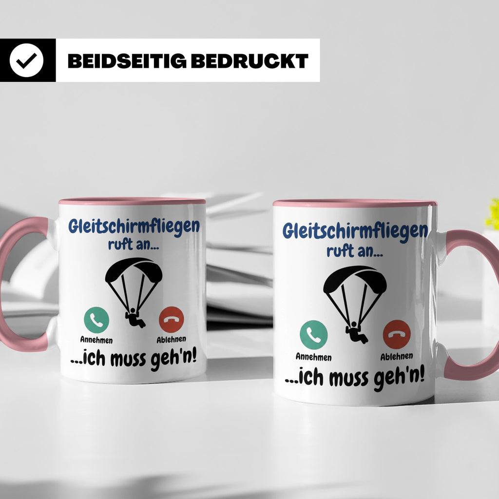 Gleitschirmfliegen Tasse mit Spruch 'ruft an ich muss geh'n' – Rosa [farbe:rosa]