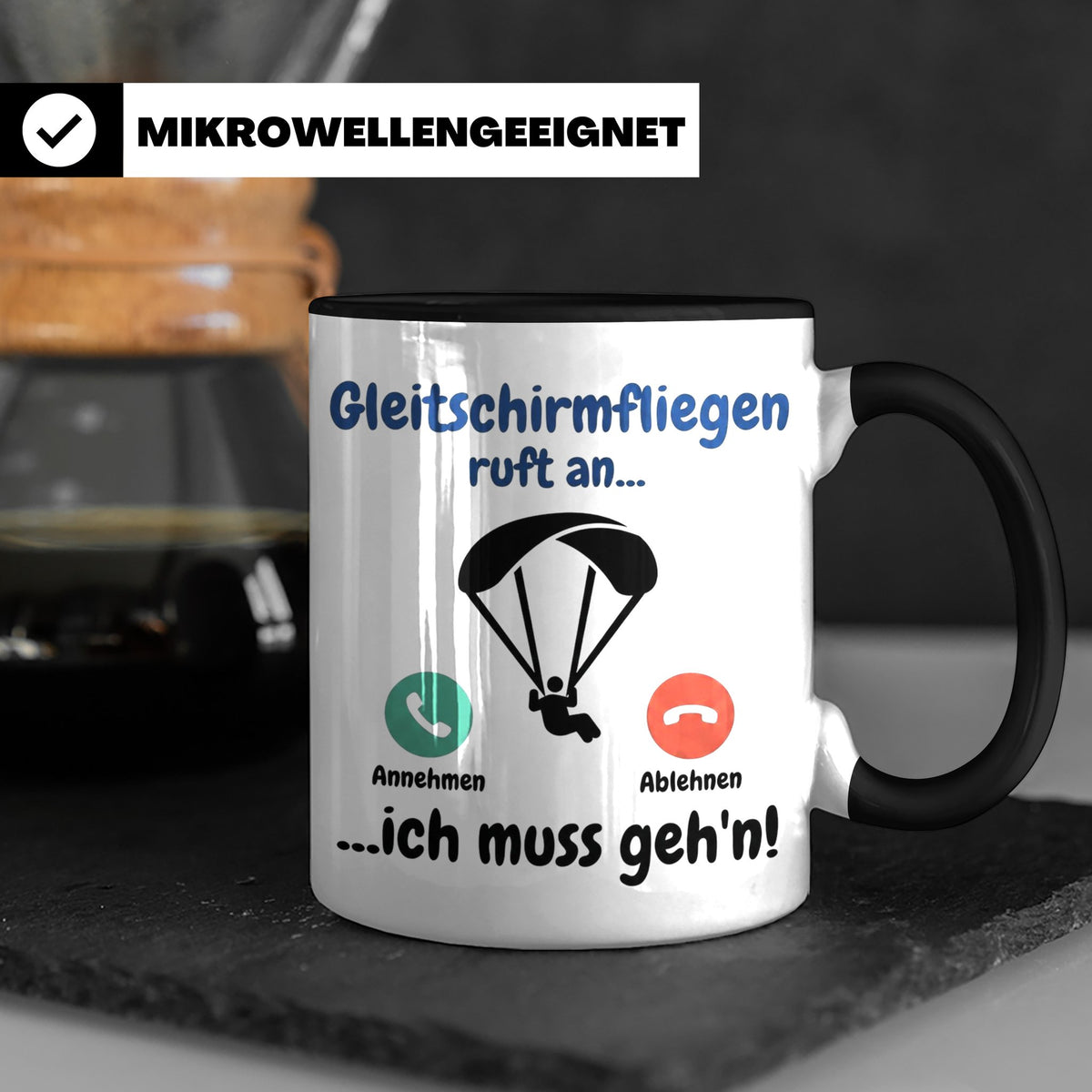 Gleitschirmfliegen Tasse mit Spruch 'ruft an ich muss geh'n' – Schwarz [farbe:schwarz]