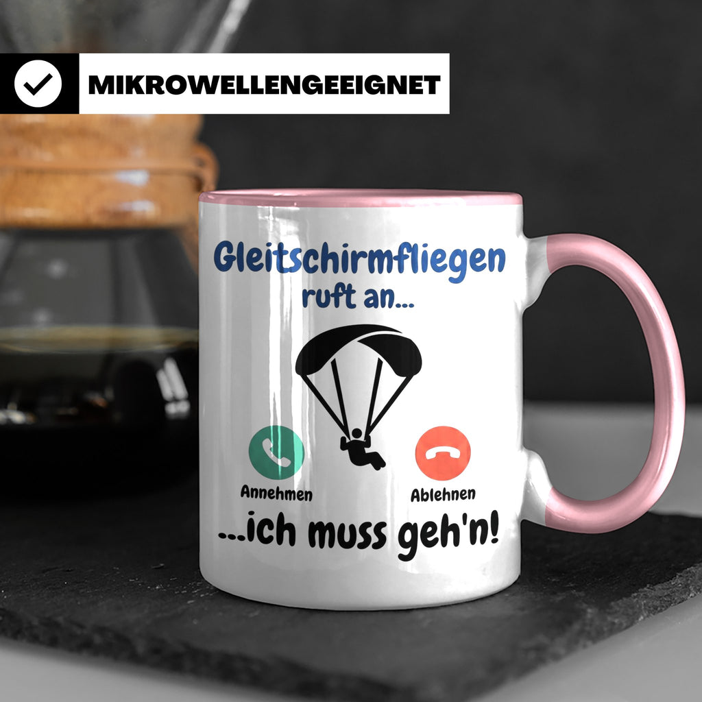Gleitschirmfliegen Tasse mit Spruch 'ruft an ich muss geh'n' – Rosa [farbe:rosa]