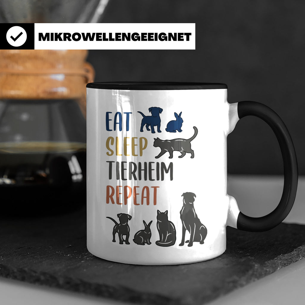 Tierheim Tasse mit Spruch Eat Sleep Repeat. Geschenk für Tie – Schwarz [farbe:schwarz]