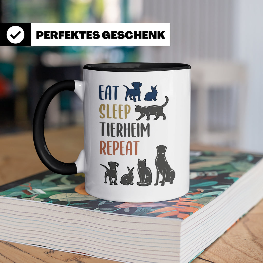 Tierheim Tasse mit Spruch Eat Sleep Repeat. Geschenk für Tie – Schwarz [farbe:schwarz]