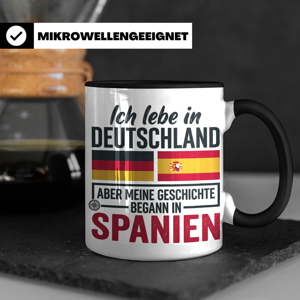 Spanier in Deutschland Tasse mit Spruch & Flagge. Geschenk f – Schwarz [farbe:schwarz]