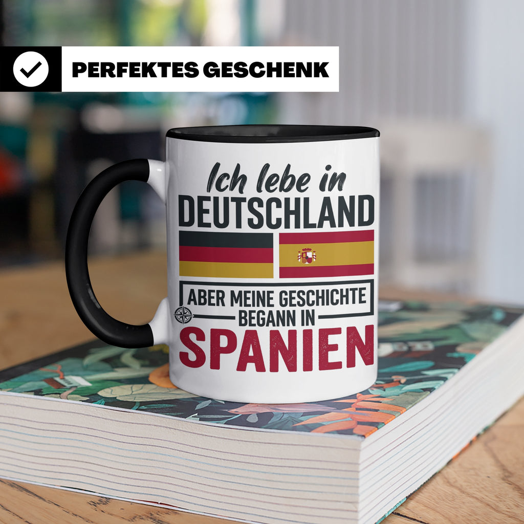 Spanier in Deutschland Tasse mit Spruch & Flagge. Geschenk f – Schwarz [farbe:schwarz]