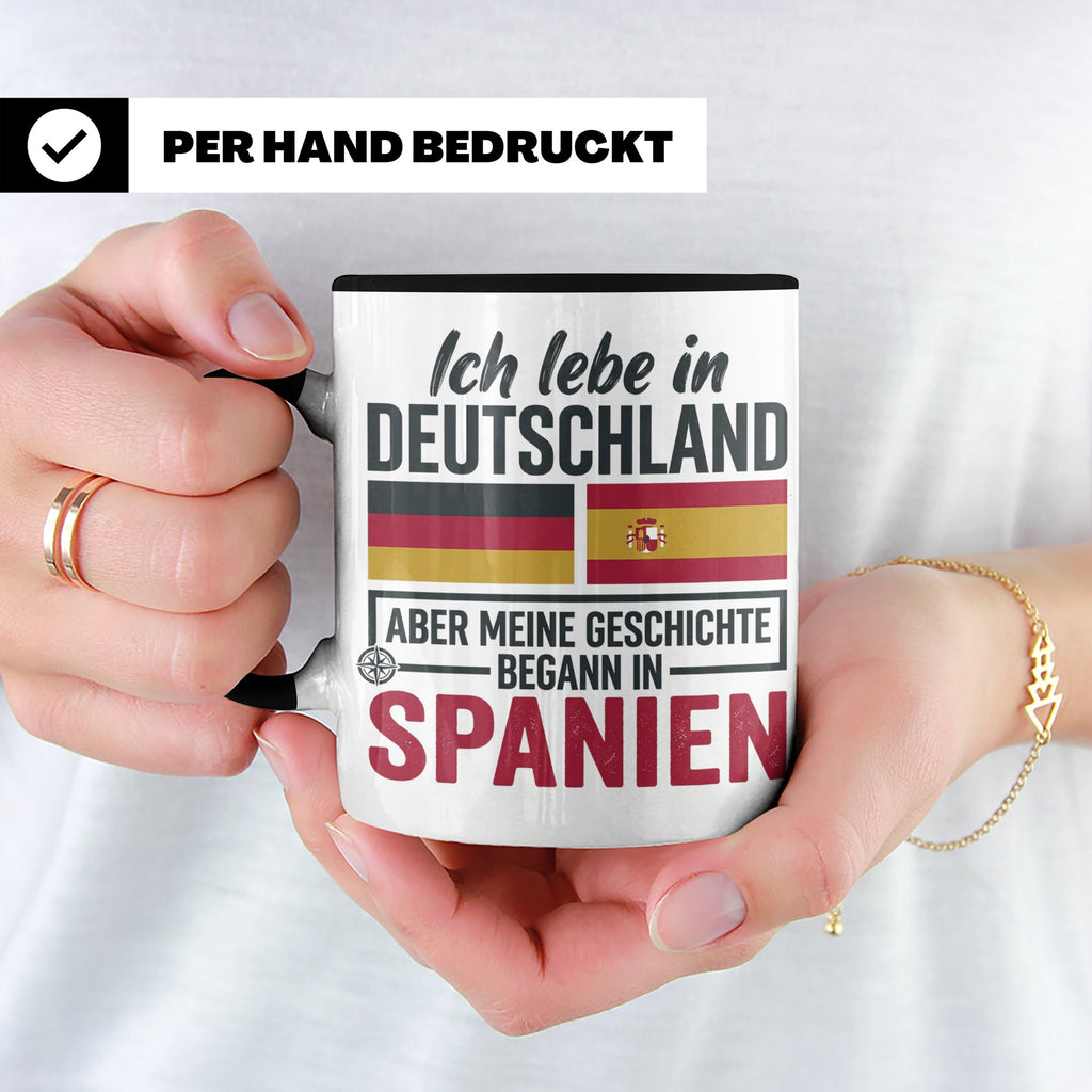 Spanier in Deutschland Tasse mit Spruch & Flagge. Geschenk f – Schwarz [farbe:schwarz]