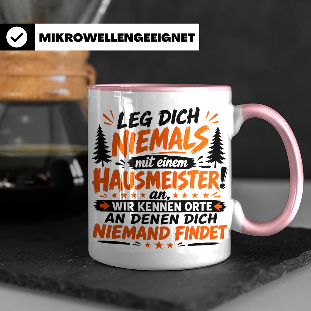 Hausmeister Tasse mit Spruch Leg dich niemals an | Geschenk  – Rosa [farbe:rosa]