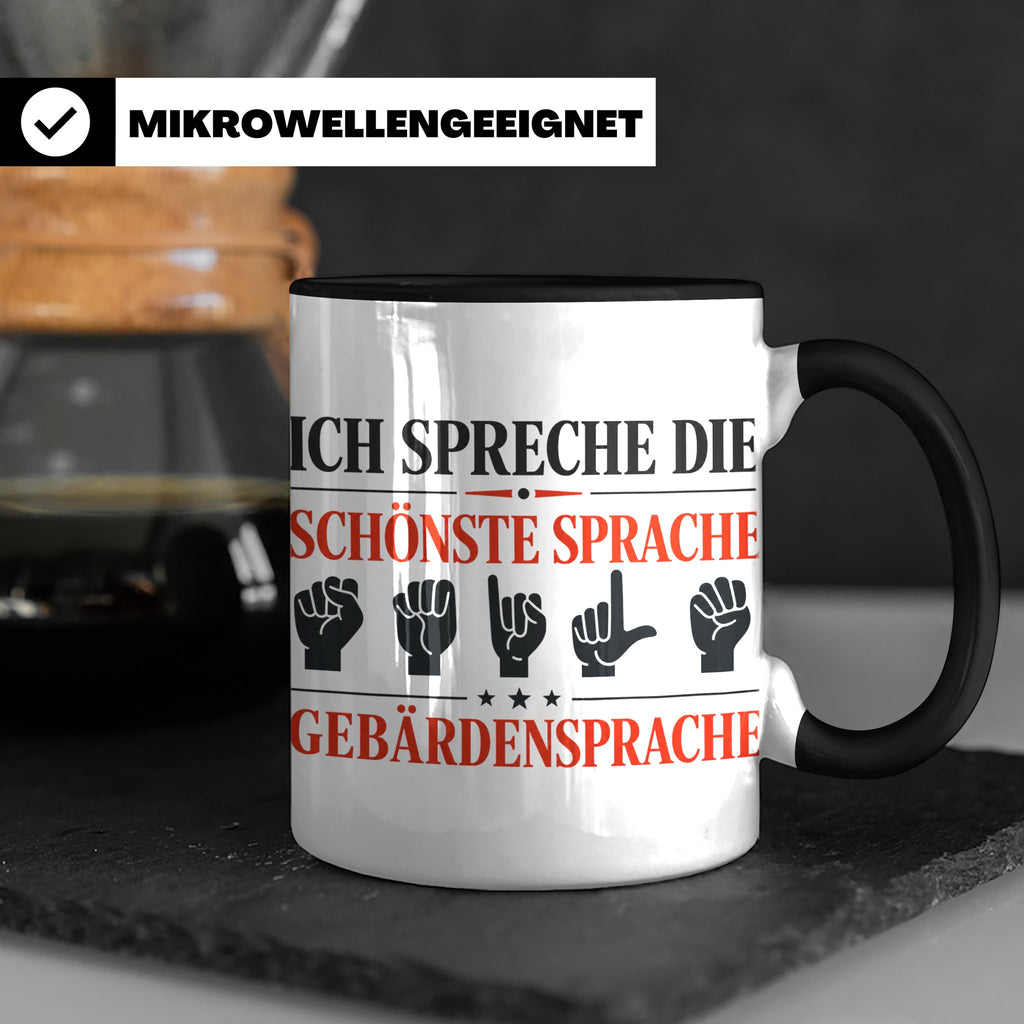 Gebärdensprache Tasse mit Spruch Ich spreche die schönste Sp – Schwarz [farbe:schwarz]