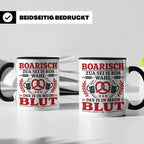 Boarisch Tasse mit Spruch Des is in meim Blut lustige Bayeri – Schwarz [farbe:schwarz]