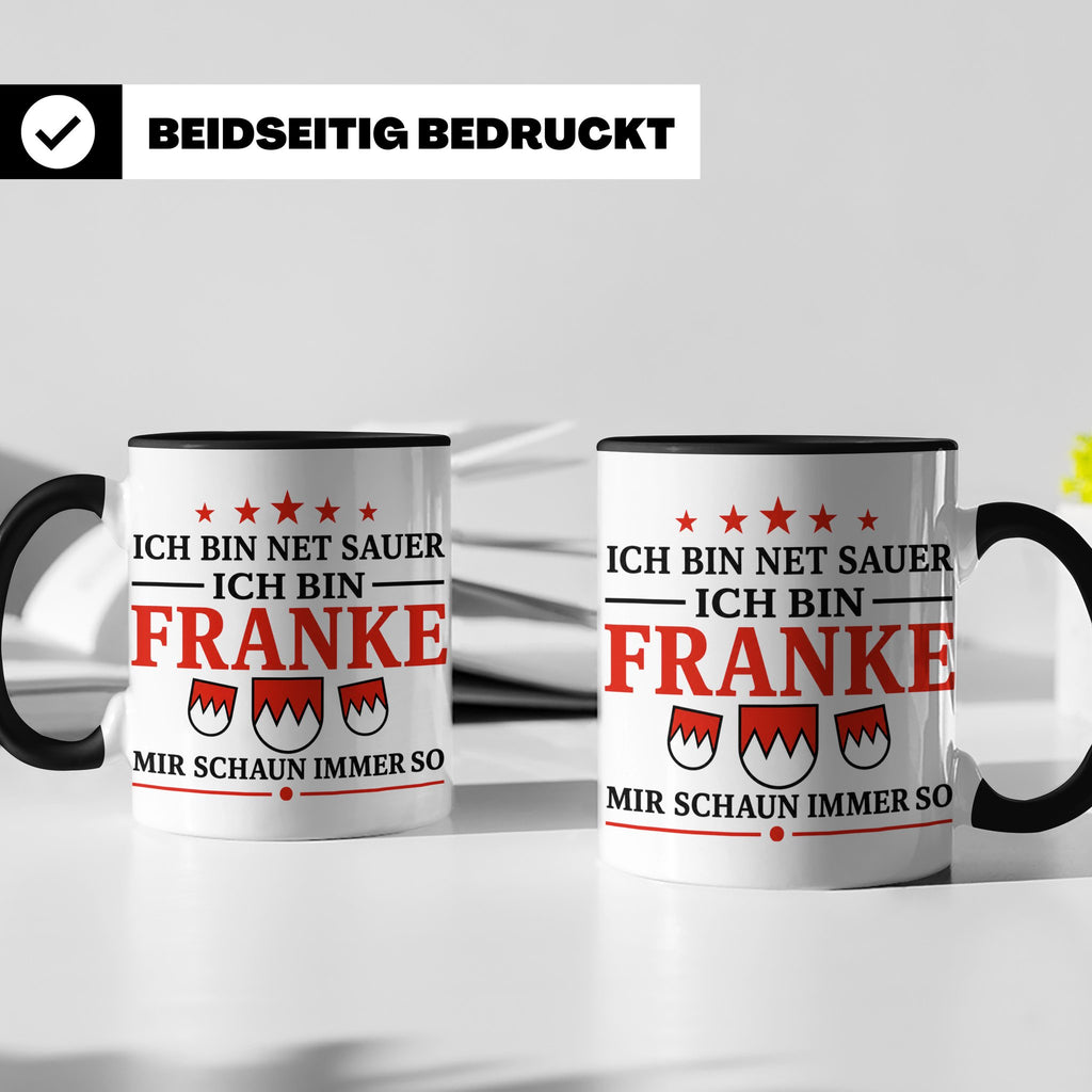 Franke Tasse mit Spruch Ich bin net sauer | Geschenk für Fra – Schwarz [farbe:schwarz]