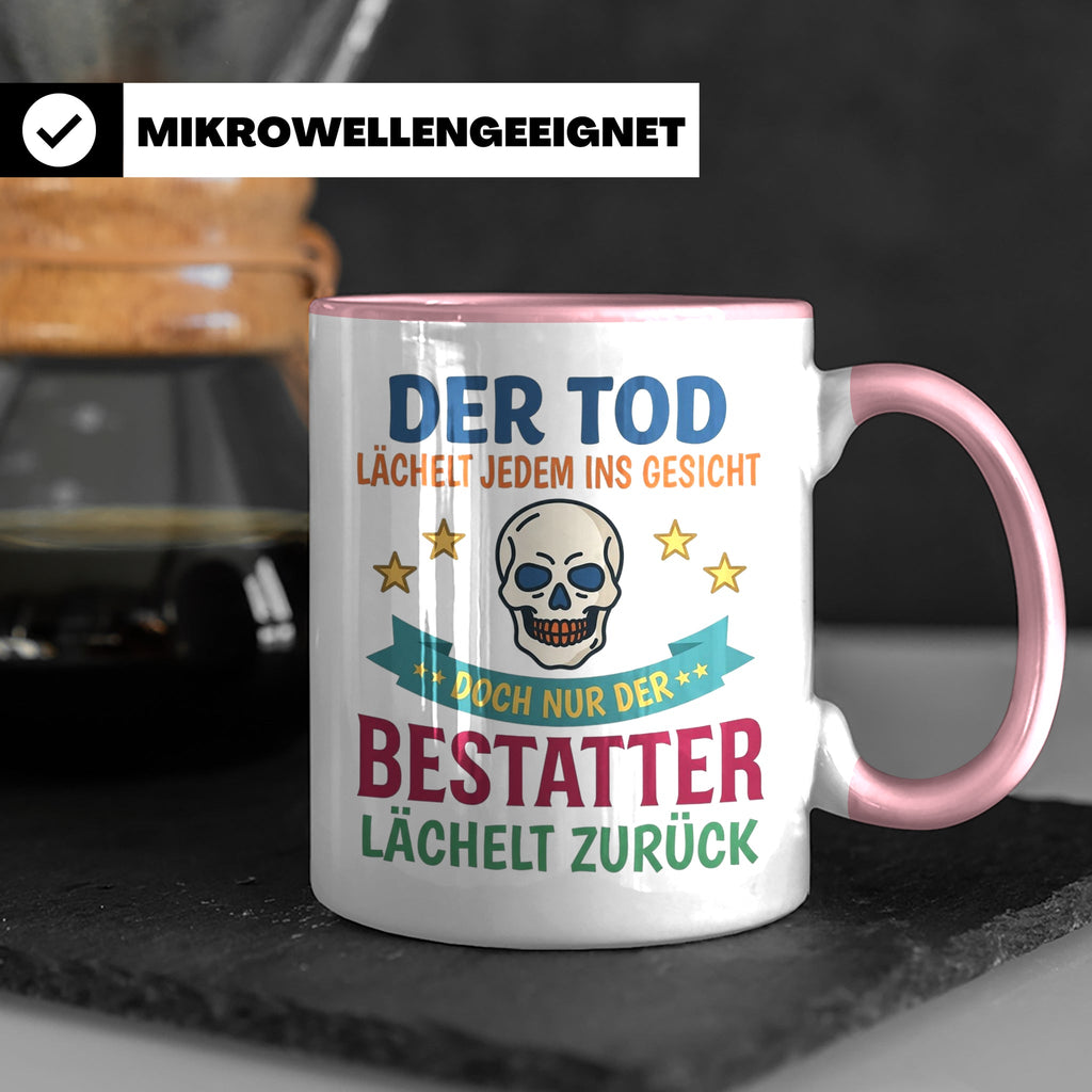 Bestatter Tasse mit Spruch Der Tod lächelt zurück | Geschenk – Rosa [farbe:rosa]